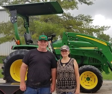customor photo with a john deer tractor
